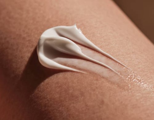 White body cream on human skin. High quality photo.